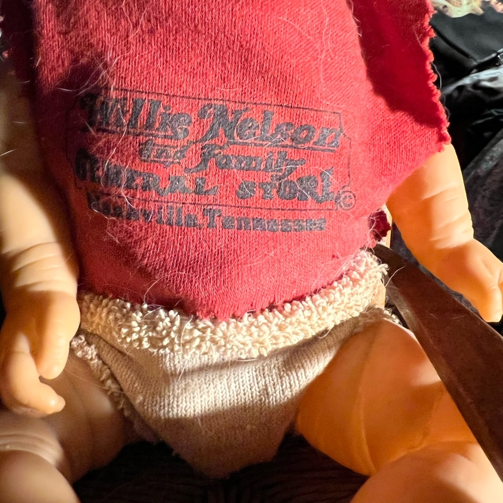 Nashville Willie Nelson Doll in the rocking chair.